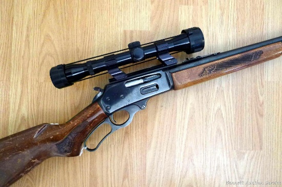 Marlin Model 30A Glenfield lever action .30-30 rifle is topped with a 4x32 scope in see-through