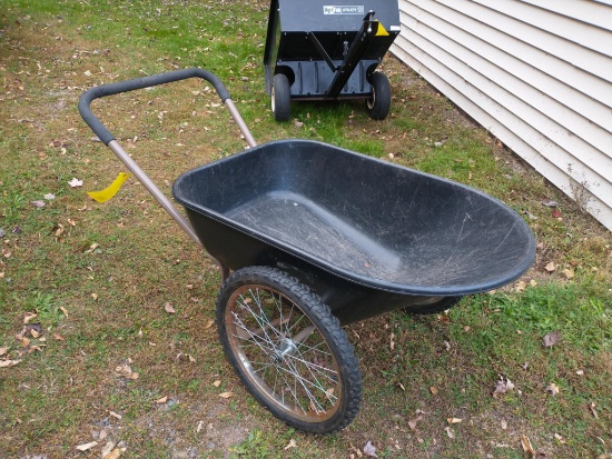 Two wheeled lawn cart or wheel barrow, has a steel frame and easy rolling 20'' tires. Tub is nearly
