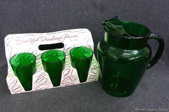 Great green 9" tall pitcher, plus green drinking glasses in original cardboard holder. Neat set.