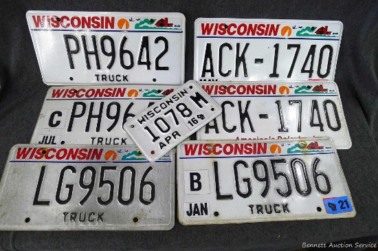 Two pairs of Wisconsin Truck license plates, Wisconsin motorcycle plate, other vehicle set. Larger