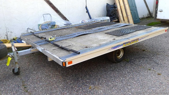 Aluminum framed Caravan snowmobile trailer with 10' x 8-1/2' tilting deck and two ski hold-down