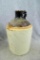 Nice stoneware jug, stands 9'' tall. There is a surface crack on side of the jug, in otherwise good