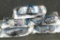 Four pair of mirrored safety glasses, plus another. All NIP.