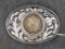 Southwest style belt buckle has what may be a real 1884 Morgan silver dollar. Buckle about 4