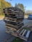 Pile of hardwood and softwood pallets, is approx 5' tall. Most pallets are around 48'' x 40'' , some