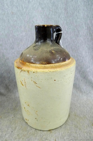 Nice stoneware jug, stands 9'' tall. There is a surface crack on side of the jug, in otherwise good