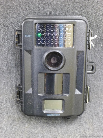 Stealth Cam digital game camera. Has lockable 6" tall case. Turns on. Looks pretty nice, handy for