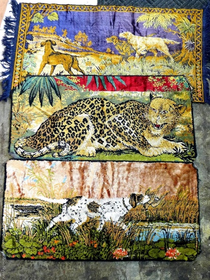 Animal wall tapestries, including cheetah and dog scenes. One dog tapestry is missing some fabric,