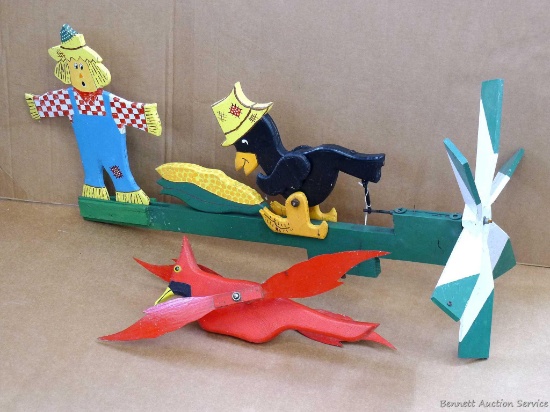Classic scarecrow whirly-gig, plus a cardinal. Larger is 3' long.