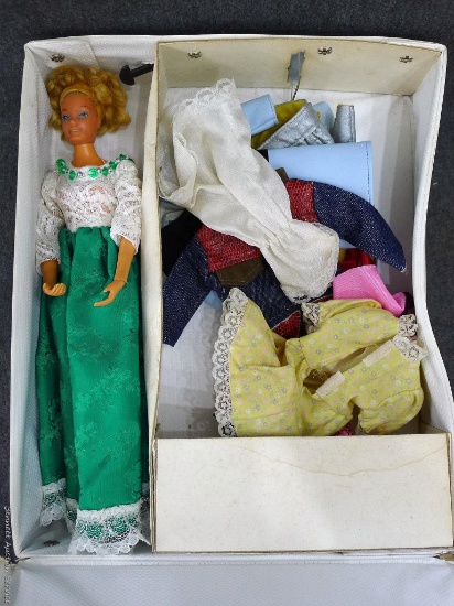 1975 Ideal doll comes in a Barbie Fashion Doll case and has several clothes. Stands about 12". Hands