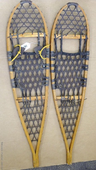 Iverson's Snowshoes Inc. wooden framed snowshoes, measures 11'' x 46''. Repairs needed to shoe