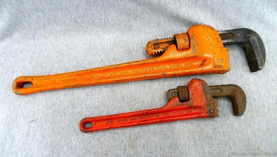 Two Rigid Heavy Duty pipe wrenches. One measures 18'' and the other 10''.
