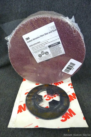 Twenty-five 7" coated abrasive discs by 3M, plus a 3M disc backer for 4-1/2" discs part #14270.
