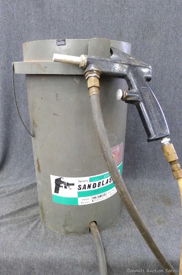 Sears sandblaster is about 17" x 12" and comes with a nozzle and hoses. Bucket and hoses look fine.