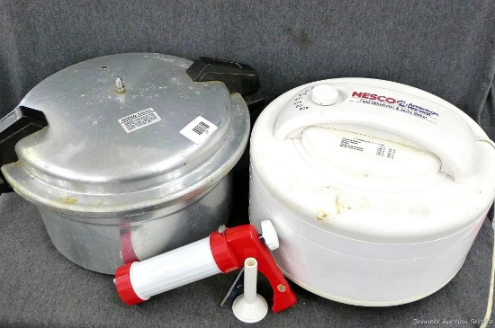 Mirro-Matic pressure cooker and Nesco food dehydrator; pressure cooker measures 17" over handles x