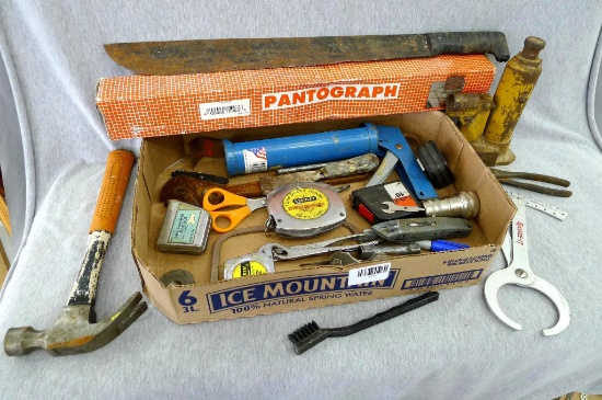 23" long machete, 50' Stanley steel tape measure, bottle jack, claw hammer, pantograph, hex wrench