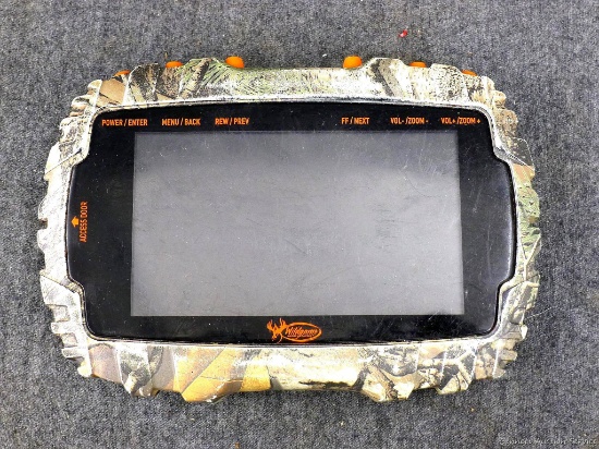 Wildgame Innovations SD card viewer; measures 6" x 4". Includes manual and powers up and includes SD