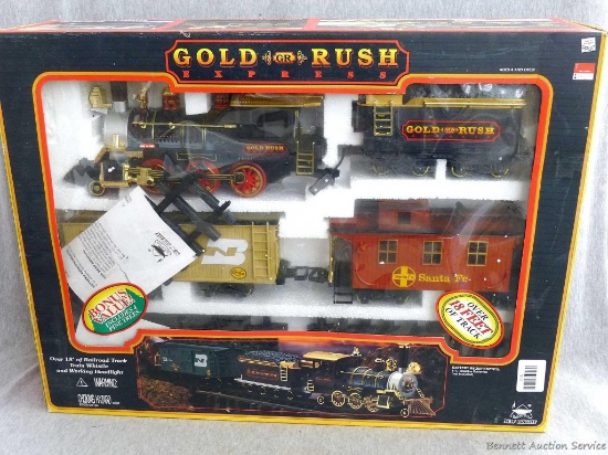 Gold Rush Express train set with over 18' of train track; engine measures 11-1/2" x 5-1/2" tall.
