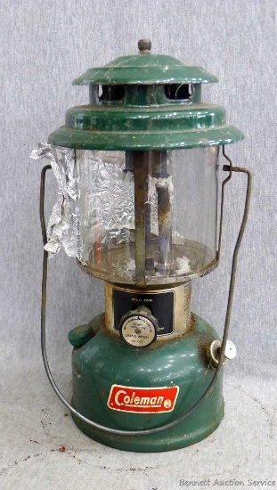 Coleman kerosene lantern, stamped 12 73 on bottom, with Coleman and Pyrex on the glass globe;