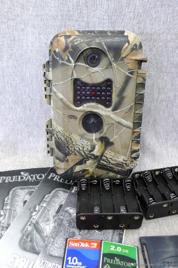 Predator Evolution trailcam with 2 compact flash cards and owners manual.