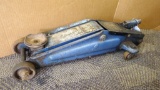 2 ton hydraulic floor jack raises and lowers, but is missing handle.