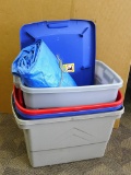 Plastic totes with one lid and tarp that has some fraying; bundle measures 14