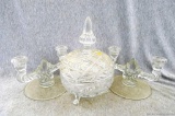 Nice glass candy dish and two candelabras. Dish measures 9'' x 6'' and candelabras measure 5'' x