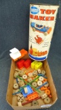 TinkerToy Toy Maker set. Pieces are in good condition. Comes with original toy container, 12''.