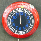 Neat Cambridge Diner lighted clock with box. Lights up but needs battery for the clock to work.