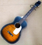 Silvertone acoustic guitar, appears to be in overall good condition with a couple paint chips and