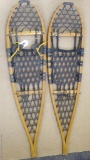 Iverson's Snowshoes Inc. wooden framed snowshoes, measures 11'' x 46''. Repairs needed to shoe