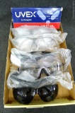 8 pair shaded and clear safety glasses by Honeywell Uvex, possibly others. Some NIP.