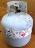 No shipping. Propane gas tank with new style head still has contents, weighs 26 lbs. Great to have