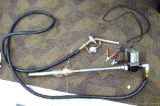 Northern Industrial 12v DC fuel transfer pump #680480 with hose and nozzle. Hose is kinked at both