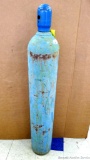 Oxygen cylinder with rusted on cap. Cylinder is marked Ohio Chemical & Surgical Equipment Co. and