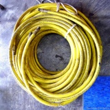 Two coils of Coleman Powermate air hose, no greater than 300 PSI; each coil measure approx. 15