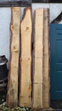 Four 8/4'' live edge pine slabs, up to 100'' long and up to 1' wide.