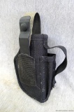 Uncle Mike's belt gun holster. Is missing strap button, in otherwise nice shape. Measures about 8''