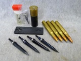 Four .30-06 cartridges four unassembled broadheads, one 12 gauge shot shell.