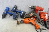 Five untested drill motors, three of which are cordless.