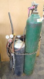 No shipping. Smith oxygen-acetylene cutting torch set with cart, extra hose, and bottles, which are