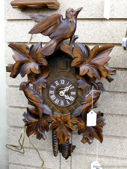 Like new cuckoo clock with 2 weights made in Germany; measures 12" x 16". Seller states it runs.