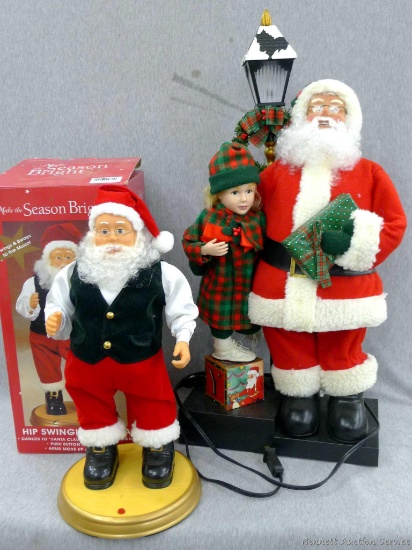 Two standing Santa decorations. Both are in nice condition, tallest stands 27''