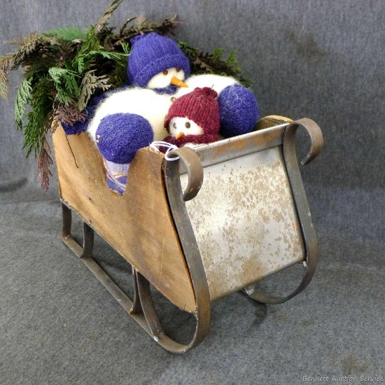 Rustic little snowman sleigh is about 13" x 5" x 11" high. In good condition.