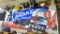 Automotive banners advertising CarQuest Brakes, JB, Firestone, Bridgestone, and others. Largest is