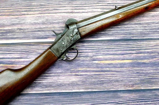 Remington Number 4 rolling block .22 rifle with lever release takedown. Octagon barrel is 22-1/2"