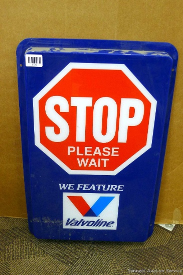 Valvoline oil sign measures 18" x 28" over flange and is in good condition.