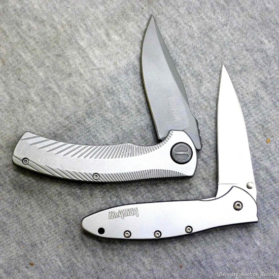 Two Kershaw folding pocket knives with pocket clips. Kershaw Speed Wave has thumb assist and liner