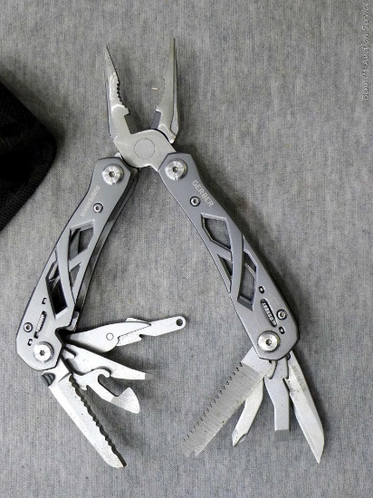 Gerber multitool with nylon sheath. Multitool is 6" open.