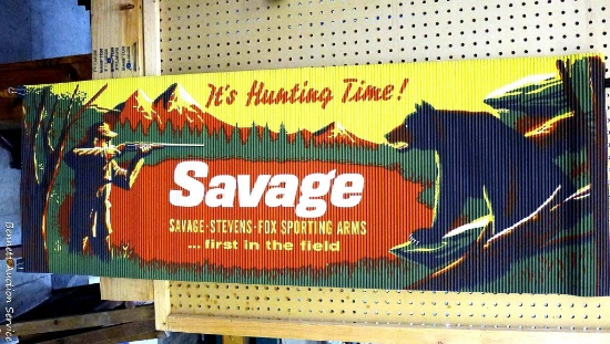 Vintage corrugated Savage Arms Corp. fall hunting display/sign; measures 54" x 19". Has original